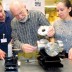 Professor John Kassakian examines a thermophotovoltaic device late last month with, from left, doctoral students Ivan Celanovic and Natalija Jovanovic. Photo / Donna Coveney