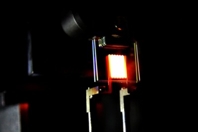 A proof-of-concept device built by MIT researchers demonstrates the principle of a two-stage process to make incandescent bulbs more efficient. This device already achieves efficiency comparable to some compact fluorescent and LED bulbs. Courtesy of the researchers